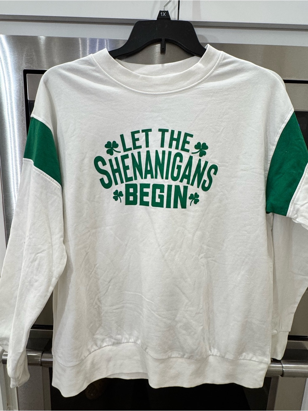 Serra White Crewneck Sweatshirt with Green Lettering and Sleeve Panels